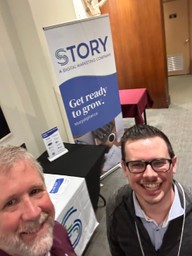 Andrew Douglas and Dave Cameron at the Story Digital booth at a recent Kentro is a conference for organizations working to address poverty and injustice worldwide.